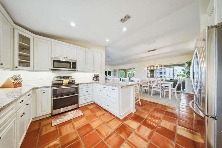 Enjoy cooking with breathtaking water views in this open-concept kitchen and dining space. Located