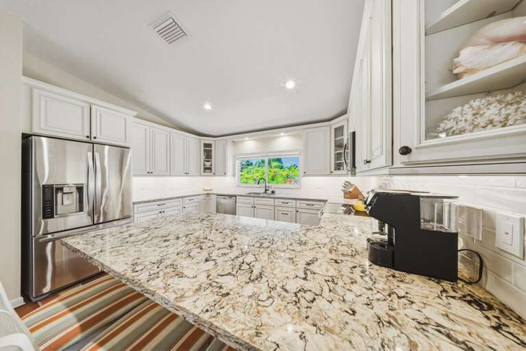 Fully equipped modern kitchen with waterfront views in a luxury Marathon FL vacation rental. This