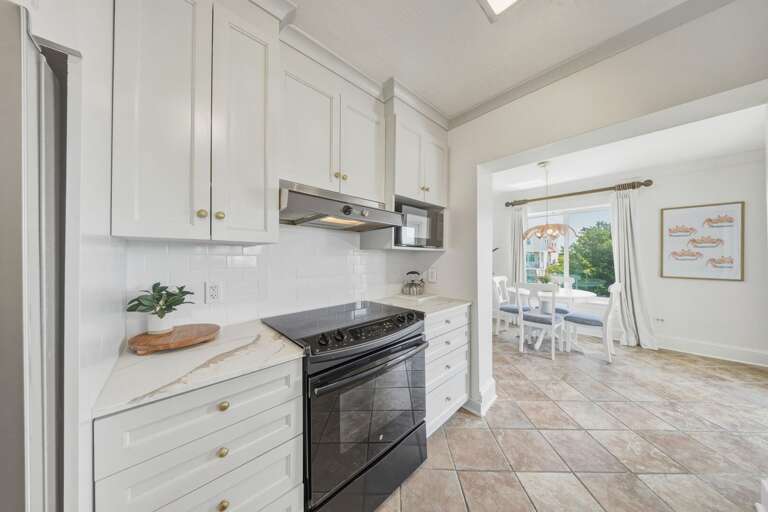 This centrally located kitchen connects seamlessly to the dining and living spaces, making it perfect for gathering during your Florida Keys vacation.