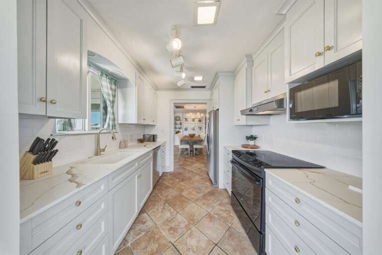 Designed for convenience and entertaining, this kitchen is perfect for preparing meals after a day at Sombrero Beach or exploring Marathon FL.