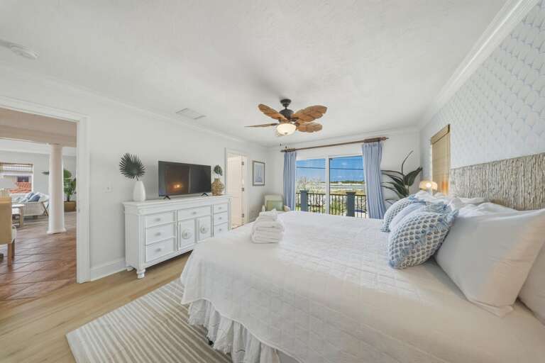 Enjoy balcony access and a peaceful retreat in this beautifully designed master bedroom in Marathon FL.