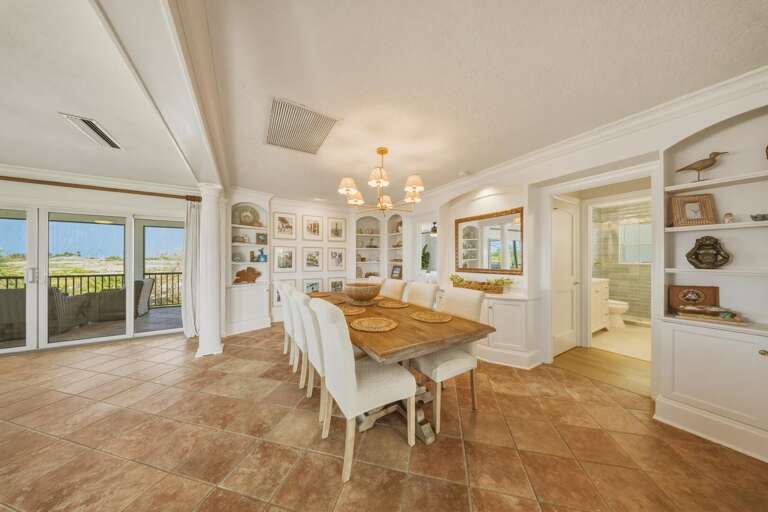 Enjoy convenient access to the kitchen and ample seating in this comfortable dining space, perfect for families staying in Marathon FL.