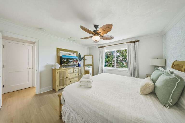 Enjoy a cozy and well-appointed king bedroom with Smart TV in your Marathon FL vacation home.