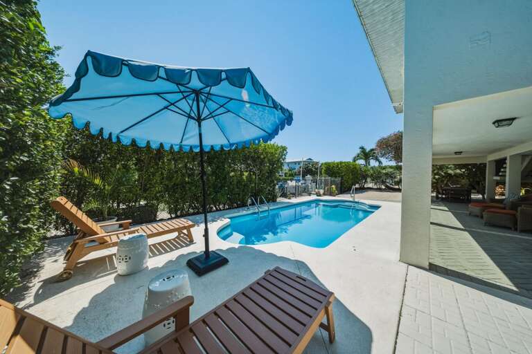 Enjoy outdoor living at its best with a private pool, seating areas, and space to unwind during your Marathon FL vacation.