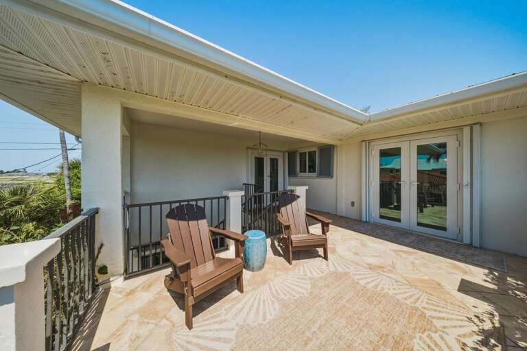 Enjoy a quiet outdoor lounge space at the entry terrace, perfect for relaxing moments during your stay in Marathon FL near Sombrero Beach.