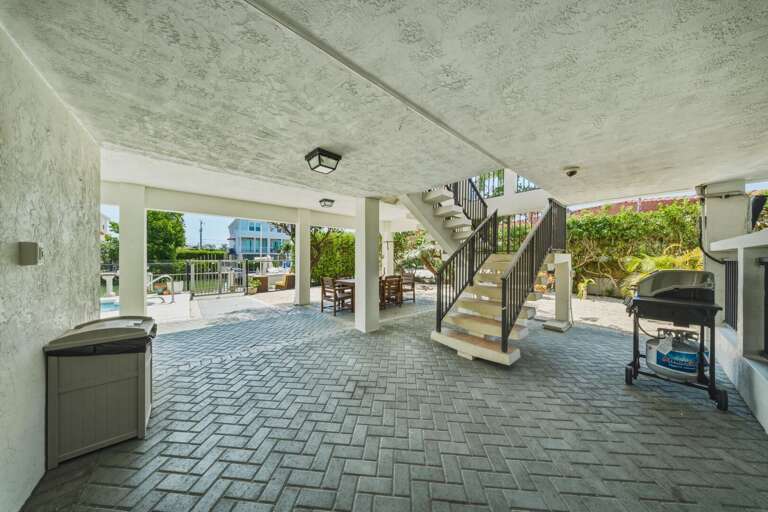 Gather around the outdoor dining area and grill for meals in the fresh Florida Keys air.