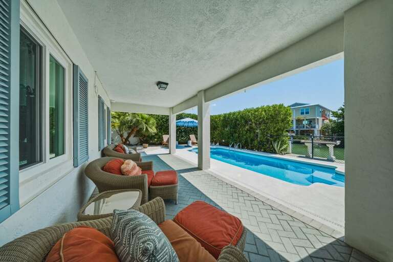 This inviting pool area offers the perfect setting for relaxation, outdoor dining, and enjoying your Florida Keys getaway.