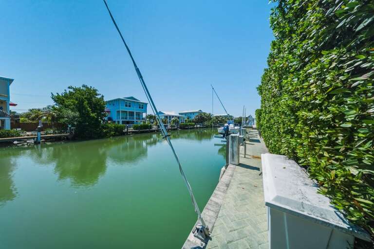 A perfect base for boating adventures, this Marathon FL home offers a private dock and easy canal access.