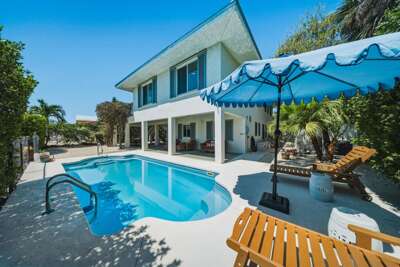 Stretch out on poolside loungers and enjoy a relaxing Florida Keys getaway in this Marathon FL vacation home.