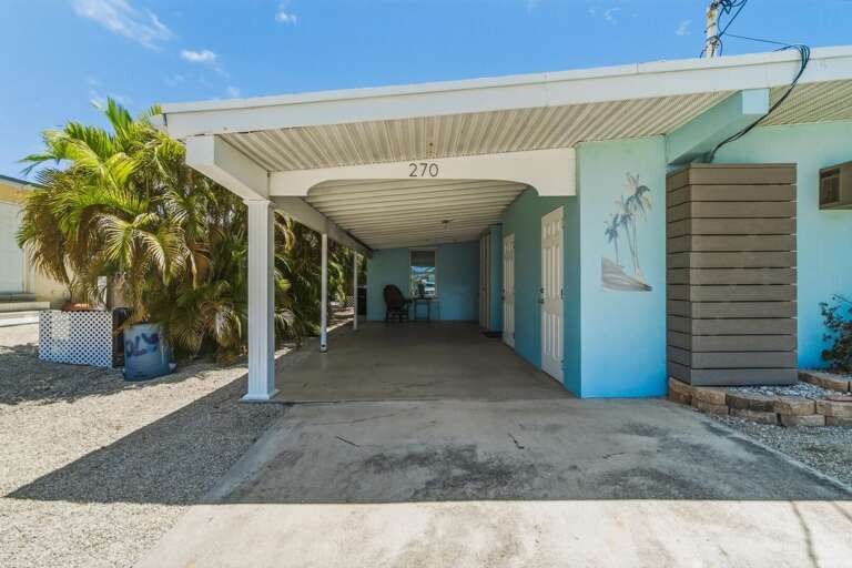 Enjoy easy parking at this canalfront Key Colony Beach half-duplex, with space for multiple vehicles and trailer parking for a smooth Florida Keys arrival.