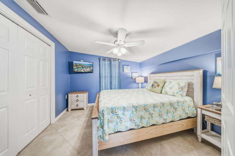This inviting queen bedroom adds flexible sleeping space for guests enjoying a boating, fishing, or family vacation in the Florida Keys.