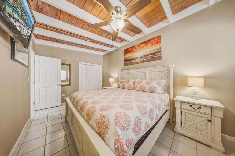 Rest comfortably in the spacious primary bedroom, a peaceful and private escape in this pet-friendly Florida Keys vacation rental.