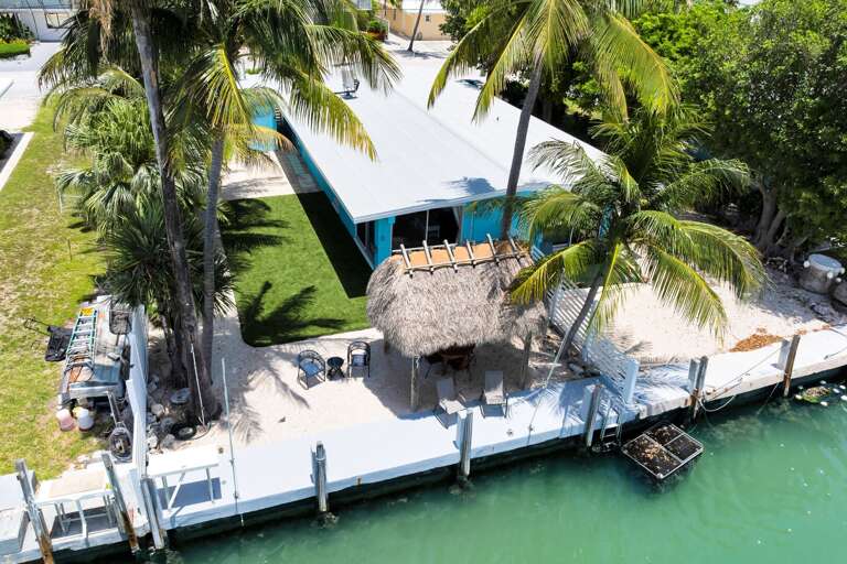 This 2-bedroom, 2-bath Key Colony Beach half-duplex offers private dockage, a tiki hut, Cabana Club access, and a comfortable home base for your Florida Keys vacation.
