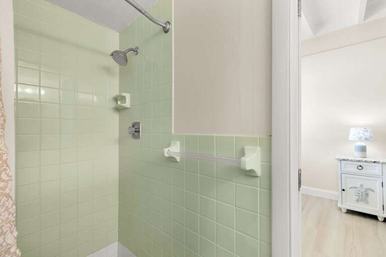 Enjoy the convenience of a primary bathroom in this comfortable Florida Keys half-duplex with private dockage, tiki hut seating, and Cabana Club access.