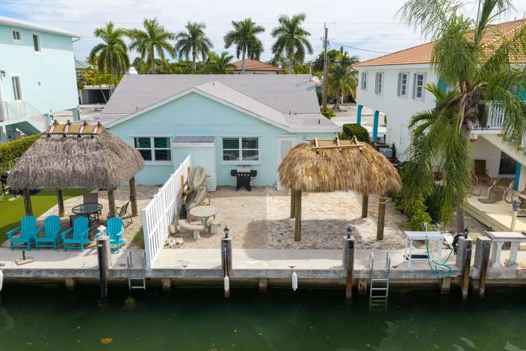 Welcome to Manatee Manor, a charming canal front retreat with private dock access and relaxing Florida Keys outdoor spaces.