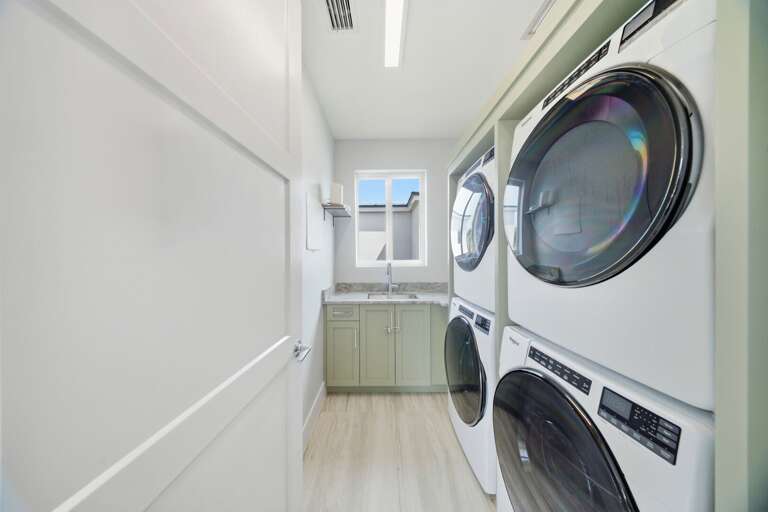 A stacked washer and dryer provide added convenience for extended stays, beach days, and family vacations in Marathon.