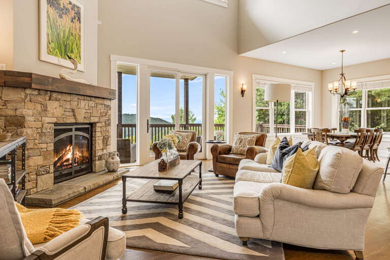 Living Area w/ Gas Fireplace & Deck Access