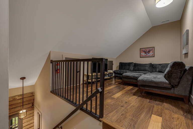 Relax in your spacious loft lounge with soaring ceilings and rich hardwood floors. Sink into the plush sectional and unwind after a day of adventure.
