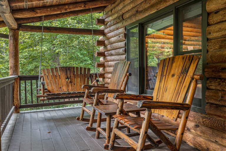 Settle into your private porch with a gentle sway on the swing or a rock in your handcrafted chair, surrounded by rustling leaves and forest tranquility.