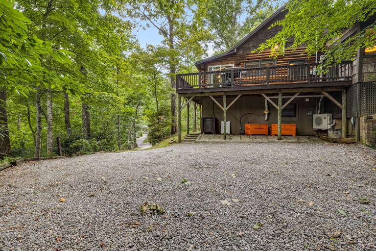 Nestled in lush forest, this charming cabin offers peaceful seclusion with convenient parking and a scenic mountain setting, perfect for your escape into nature.