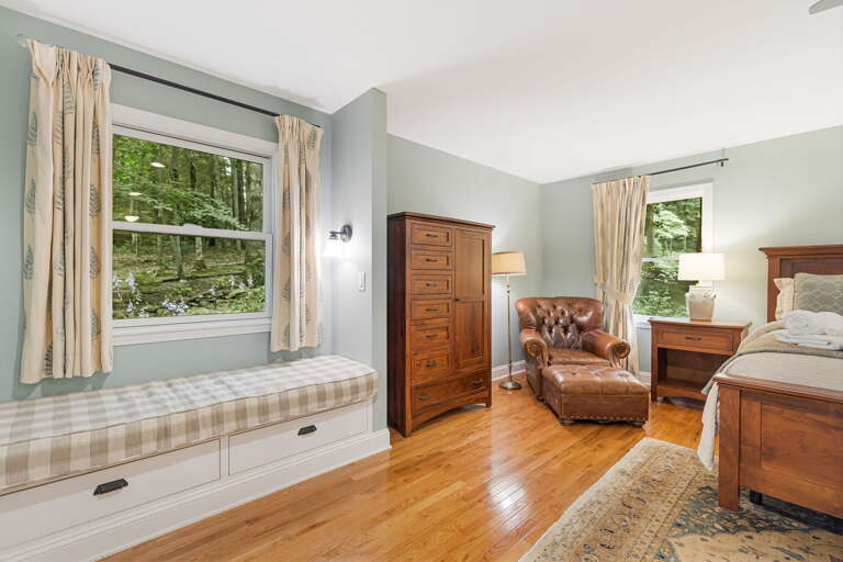 Main Suite/Bedroom One - w/ Seating Main Suite/Bedroom One - w/ Seating