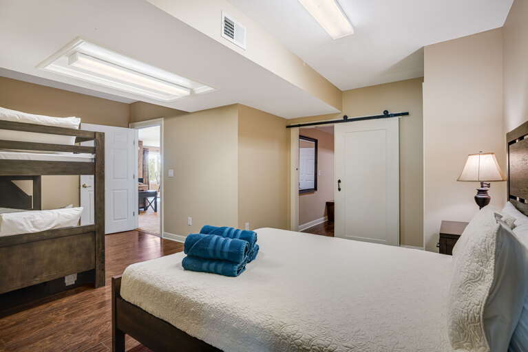 Bedroom Seven - First Queen Bed & Two Twin Beds (Bunks)