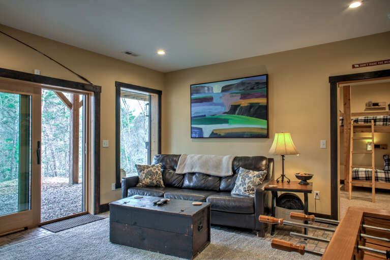 Lower Level - Living Area w/ Access to Hot Tub & Creek Access Point