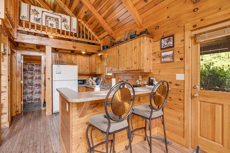 Kitchen w/ Breakfast Bar Seating & Rustic Cabin Decor Kitchen w/ Breakfast Bar Seating & Rustic Cabin Decor