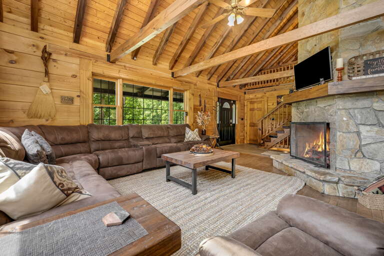 Living Area w/ Wood Fireplace and Smart TV