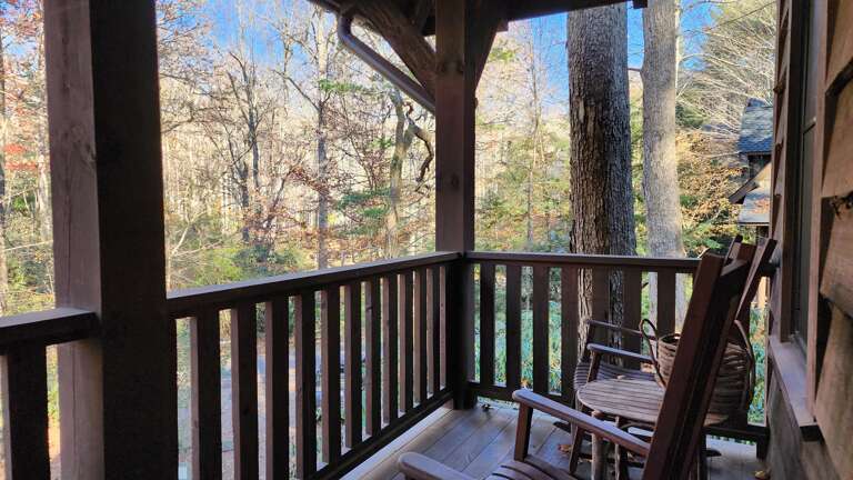 Covered Deck w/ Rustic Furnishings & Wooded Surroundings