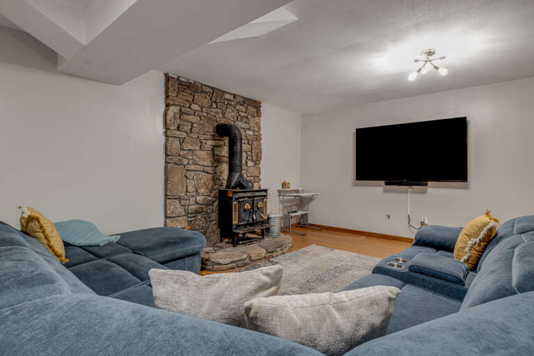 Lower Level - Living Area w/ Smart TV and Wood Stove