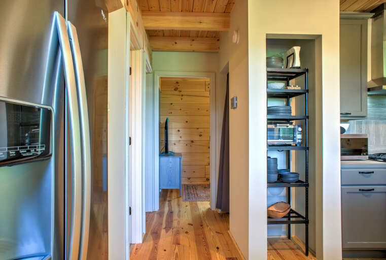 Hallway to Bedroom 1, Second Living Area and Laundry Area