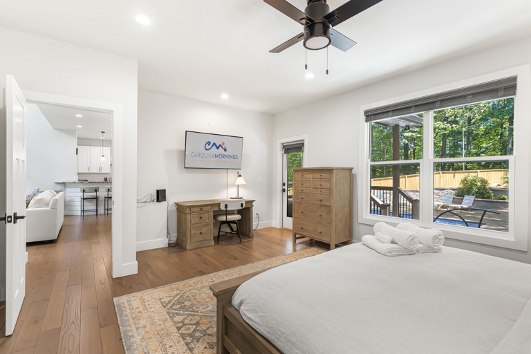 Main Suite/Bedroom One - King Bed w/ Smart TV, Office Space, & Back Deck Access
