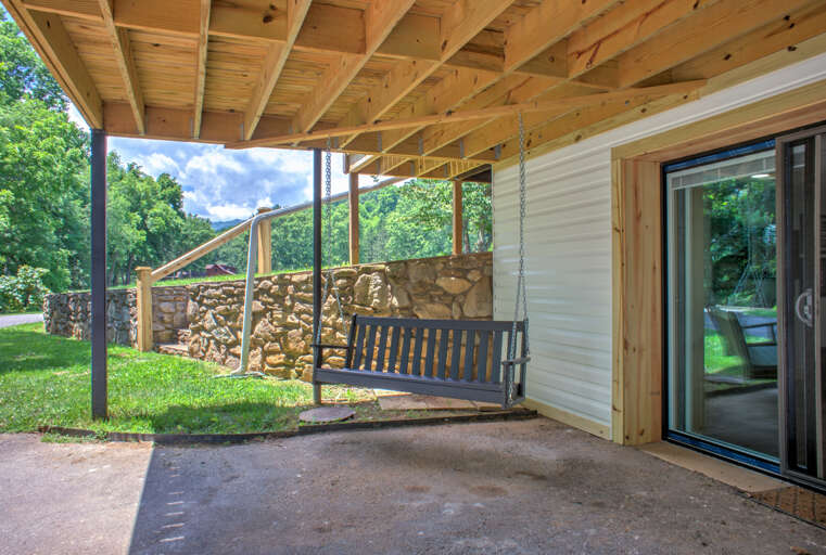 Relax in the Rocking Swing Under the Covered Patio