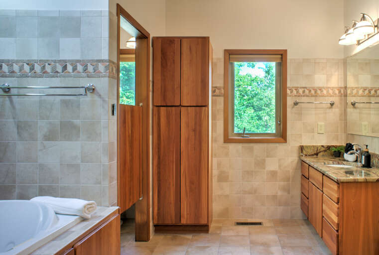 Main Suite/Bedroom One - attached Full Bath with Soaking Tub and Dual Vanities Main Suite/Bedroom One - attached Full Bath with Soaking Tub and Dual Vanities