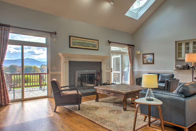 Living Area w/ Wood Burning Fireplace, Vaulted Ceilings, Open Floorplan & Luxury Furnishings Living Area w/ Wood Burning Fireplace, Vaulted Ceilings, Open Floorplan & Luxury Furnishings