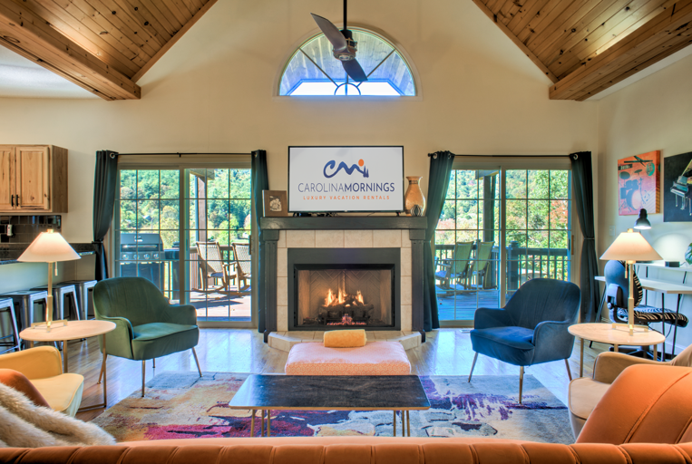 Living Area w/ Gas Fireplace, Vaulted Ceiling, and Modern Decor Living Area w/ Gas Fireplace, Vaulted Ceiling, and Modern Decor