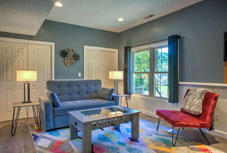 Rec Room w/ Queen Sleeper Sofa, Foosball Coffee Table, and Dartboard