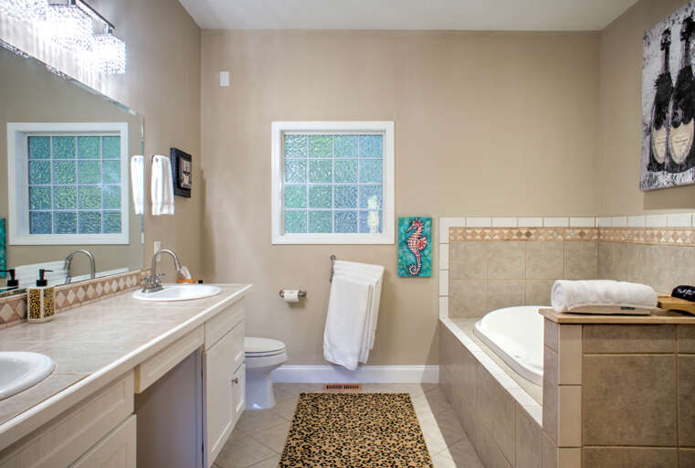 Main Suite/Bedroom One - Attached Full Bath w/ Walk-In Shower, Jetted Tub, and Dual Vanities