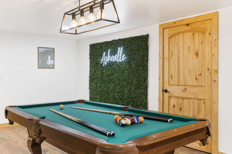 Lower Level Living Area w/ Pool Table & Workout Space Lower Level Living Area w/ Pool Table & Workout Space