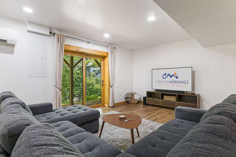 Lower Level - Living Area w/ Smart TV & Outdoor Access