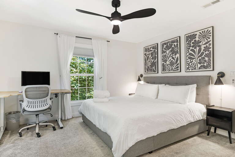 Main Suite/Bedroom One - King Bed, Desk & Monitor for Remote Work Main Suite/Bedroom One - King Bed, Desk & Monitor for Remote Work