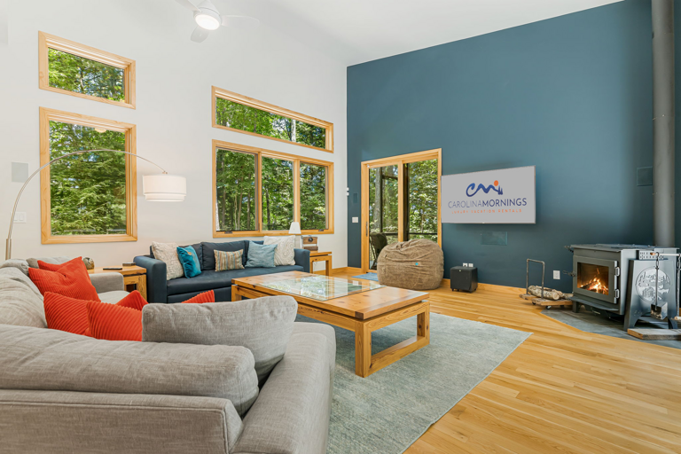 Living Area w/ Constellation Projector, Smart TV, Wood Stove & Screened-In Deck Living Area w/ Constellation Projector, Smart TV, Wood Stove & Screened-In Deck