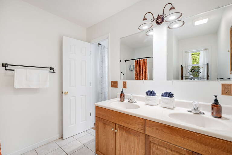 Main Suite/Bedroom One - Attached Full Bath w/ Dual Vanities