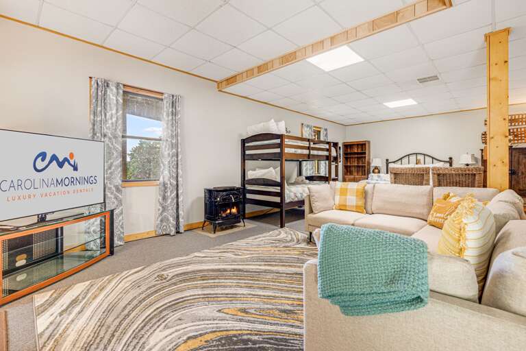Bedroom Three - Living Area w/ Smart TV & Non-Functioning Aesthetic Wood Stove