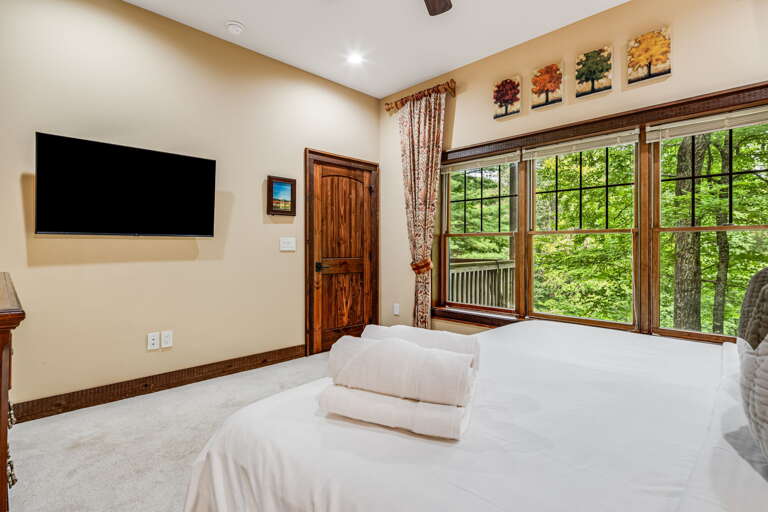Main Suite/Bedroom Five - Queen Bed w/ Smart TV