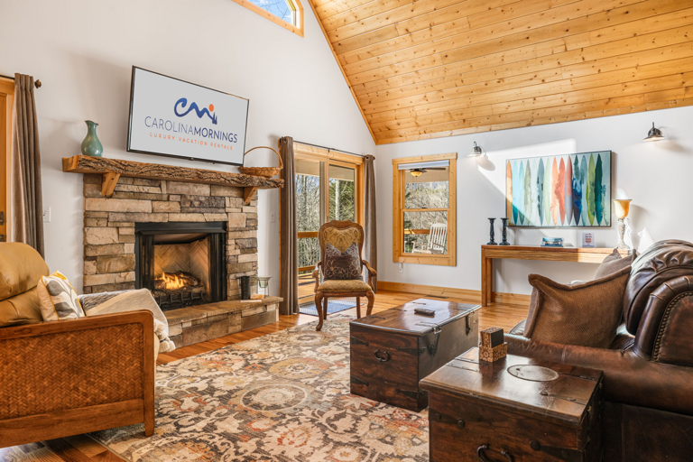 Living Area w/ Gas Fireplace & Vaulted Ceiling