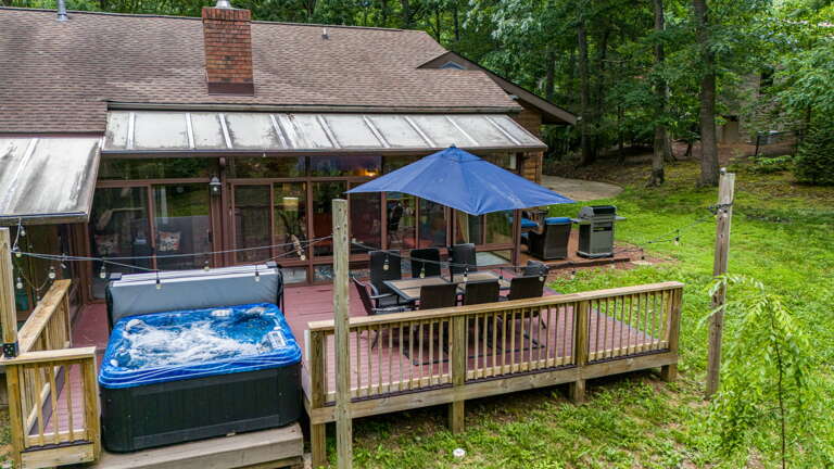 Gas Grill, Outdoor Dining, And Hot Tub Area