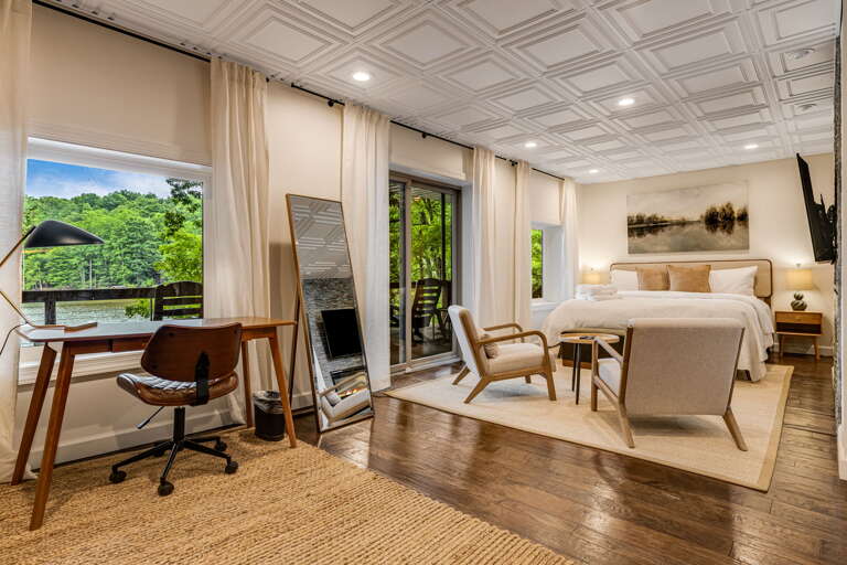 Lower Level - Main Suite/Bedroom Five - King Bed w/ Deck Access & Dedicated Workspace