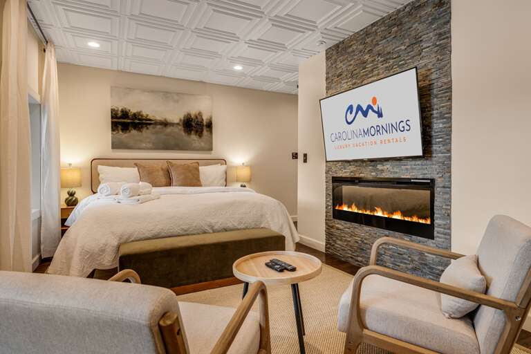 Main Suite/Bedroom Five - King Bed w/ Smart TV, Linear Fireplace, and Attached Shower Bath